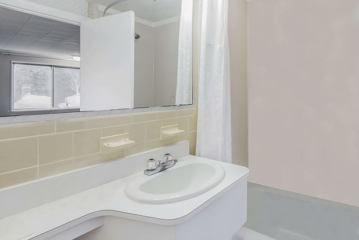 Standard room bathroom at Relax Inn Cape Cod